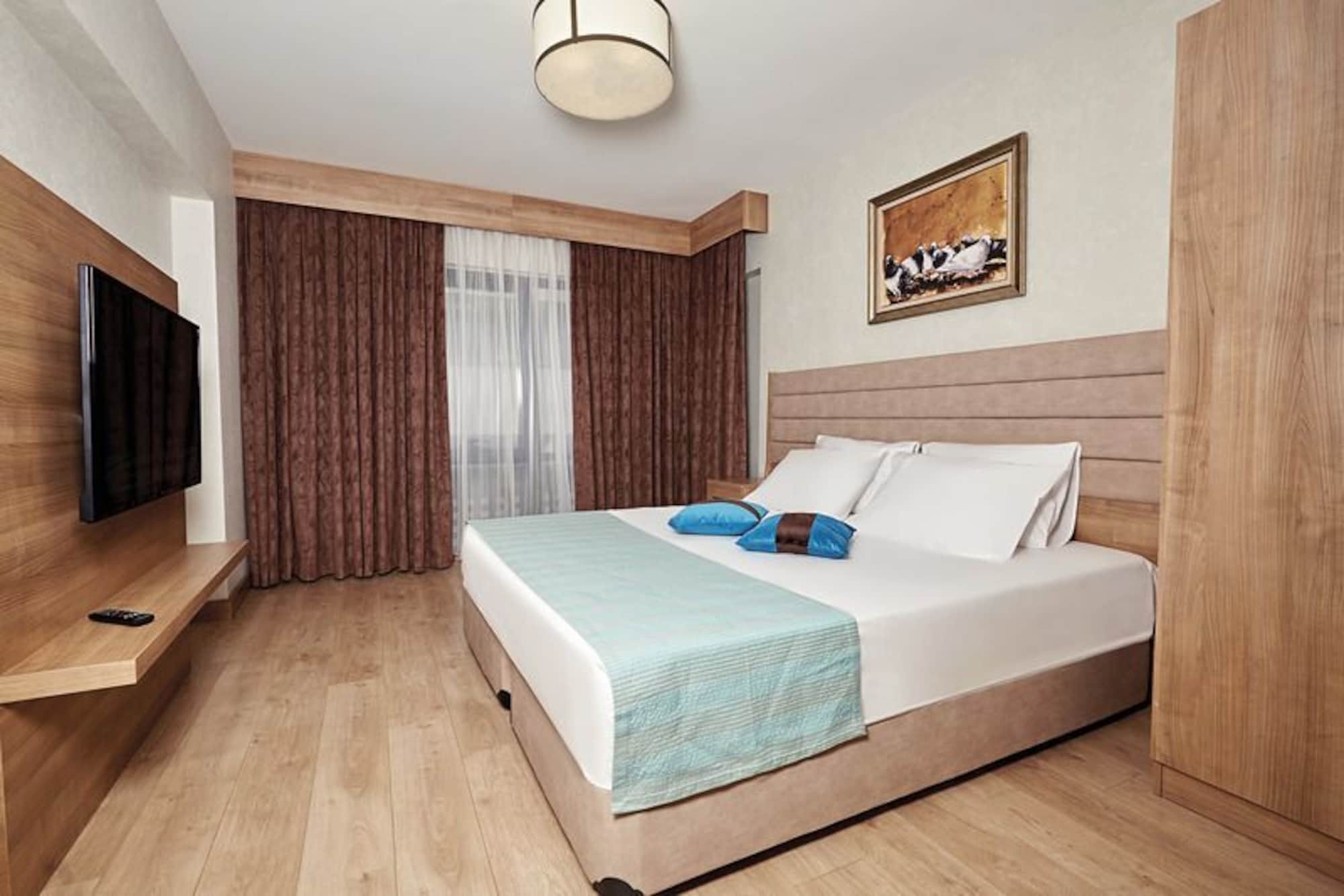 Bursa Suites Apart Otel Exterior foto A bedroom in a hotel